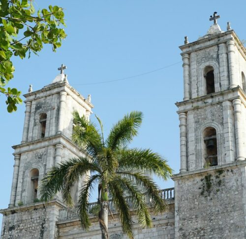 Large white church with two tall towers in Valladolid, Yucatan, Mexico