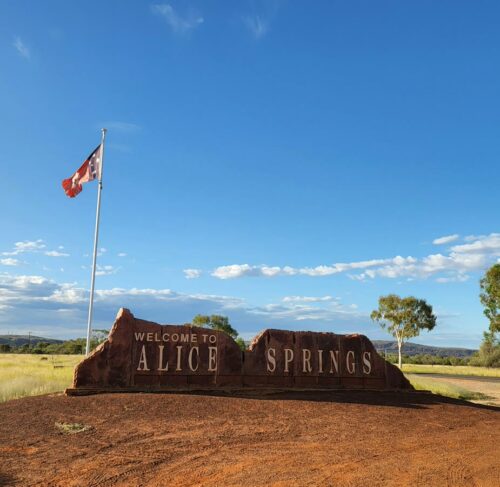 Sign beside a dirt road in Alice Springs, Northern Territory, Australia