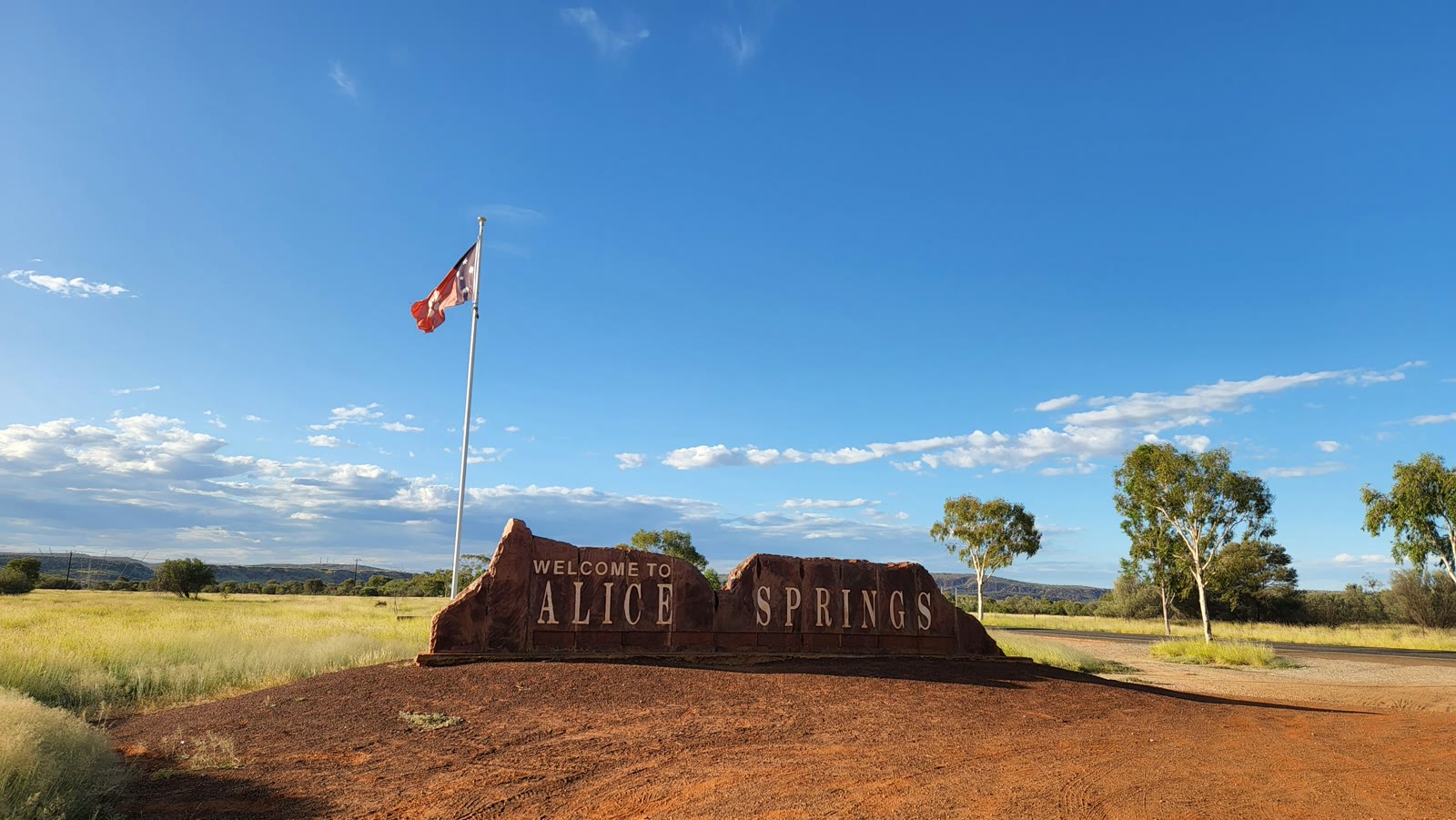 Sign beside a dirt road in Alice Springs, Northern Territory, Australia