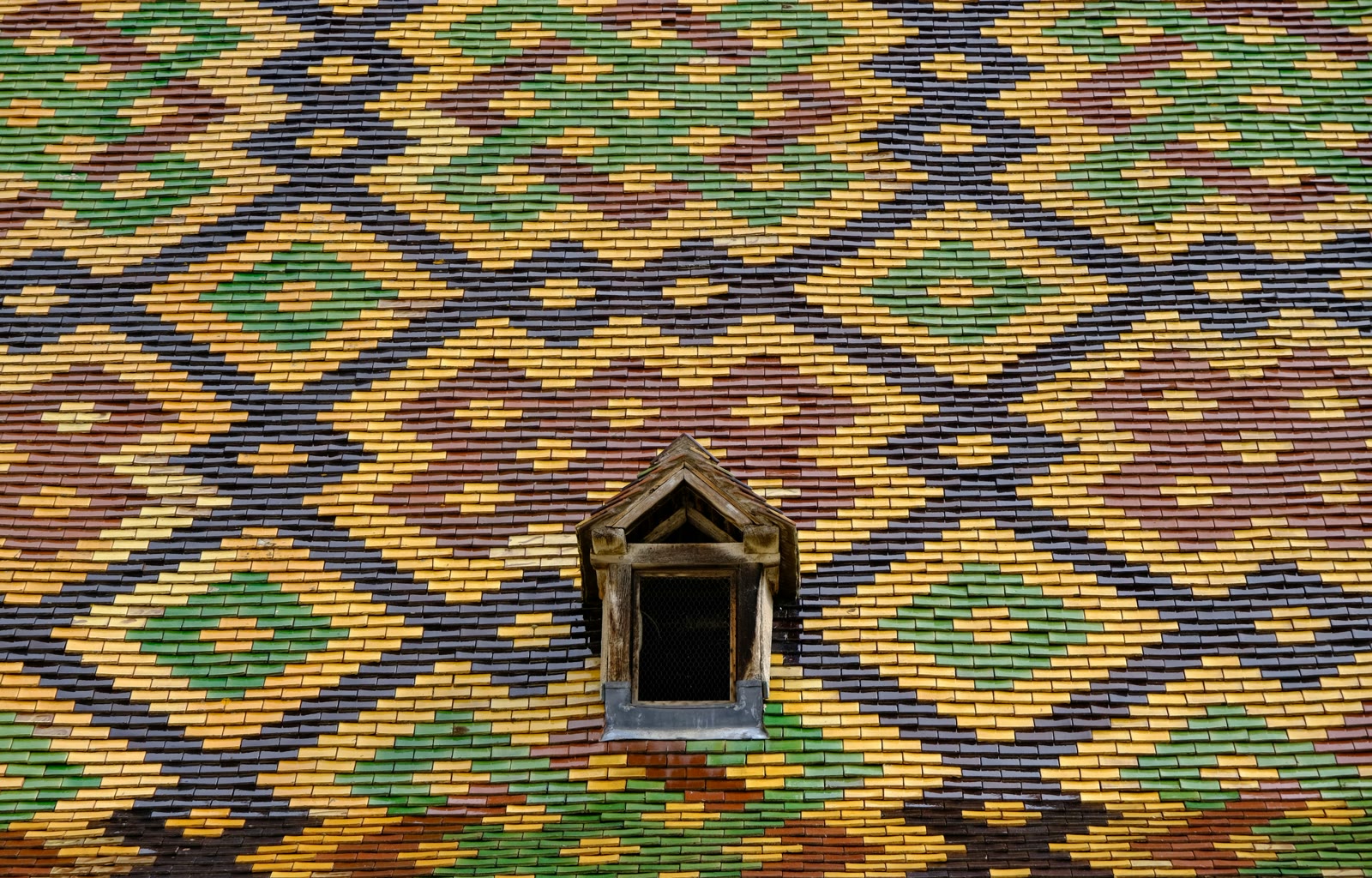 Close-up of a building with a window in Beaune, France