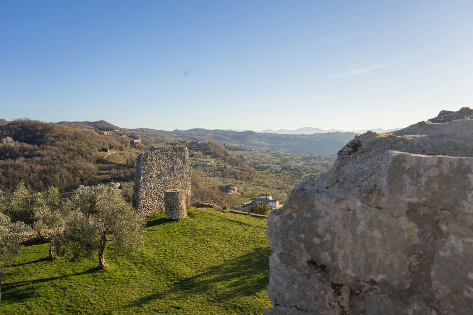 Field with a castle in the distance in Civitavecchia, Lazio, Italy