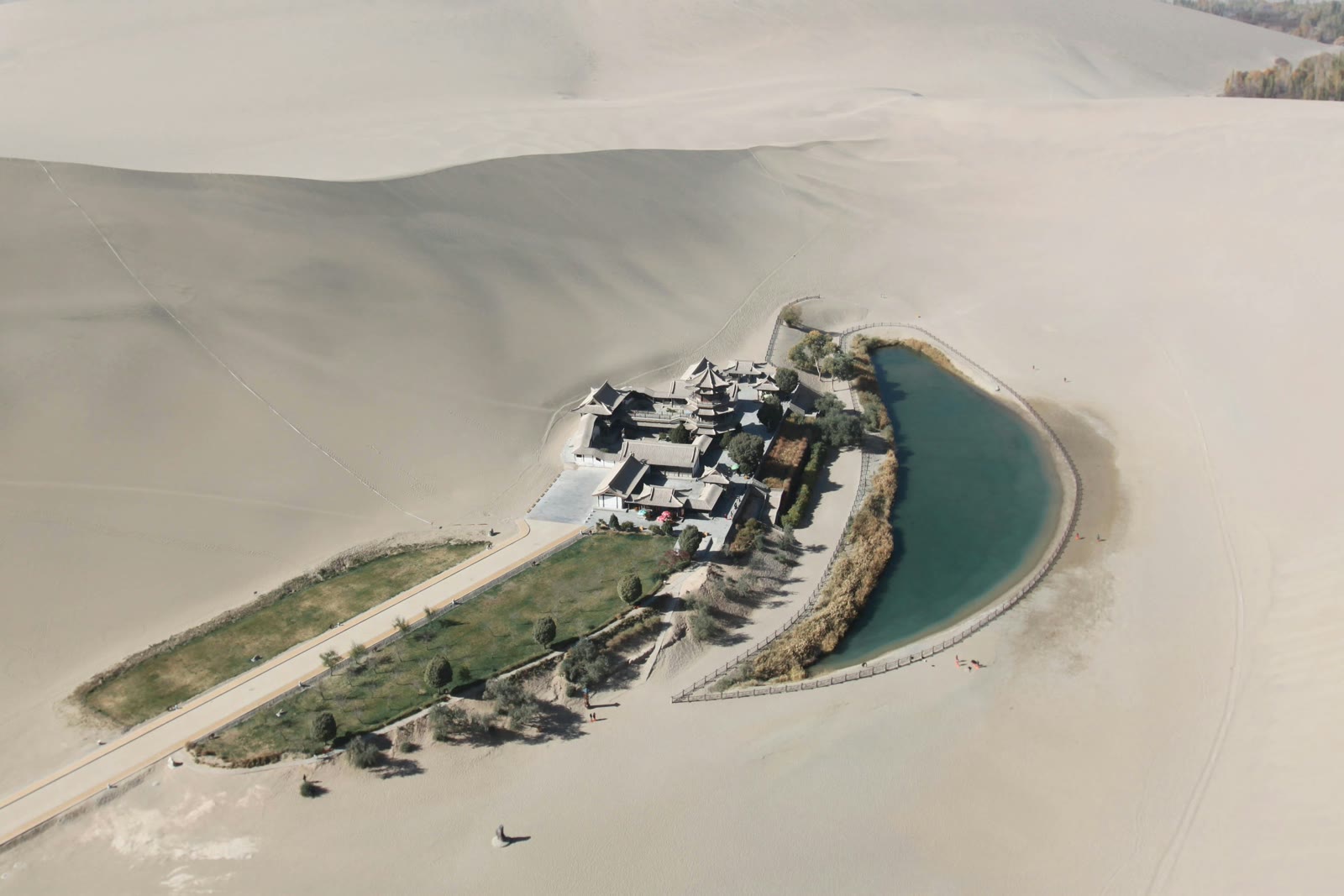Aerial view of a white and grey house on white sand in Dunhuang, Gansu, China