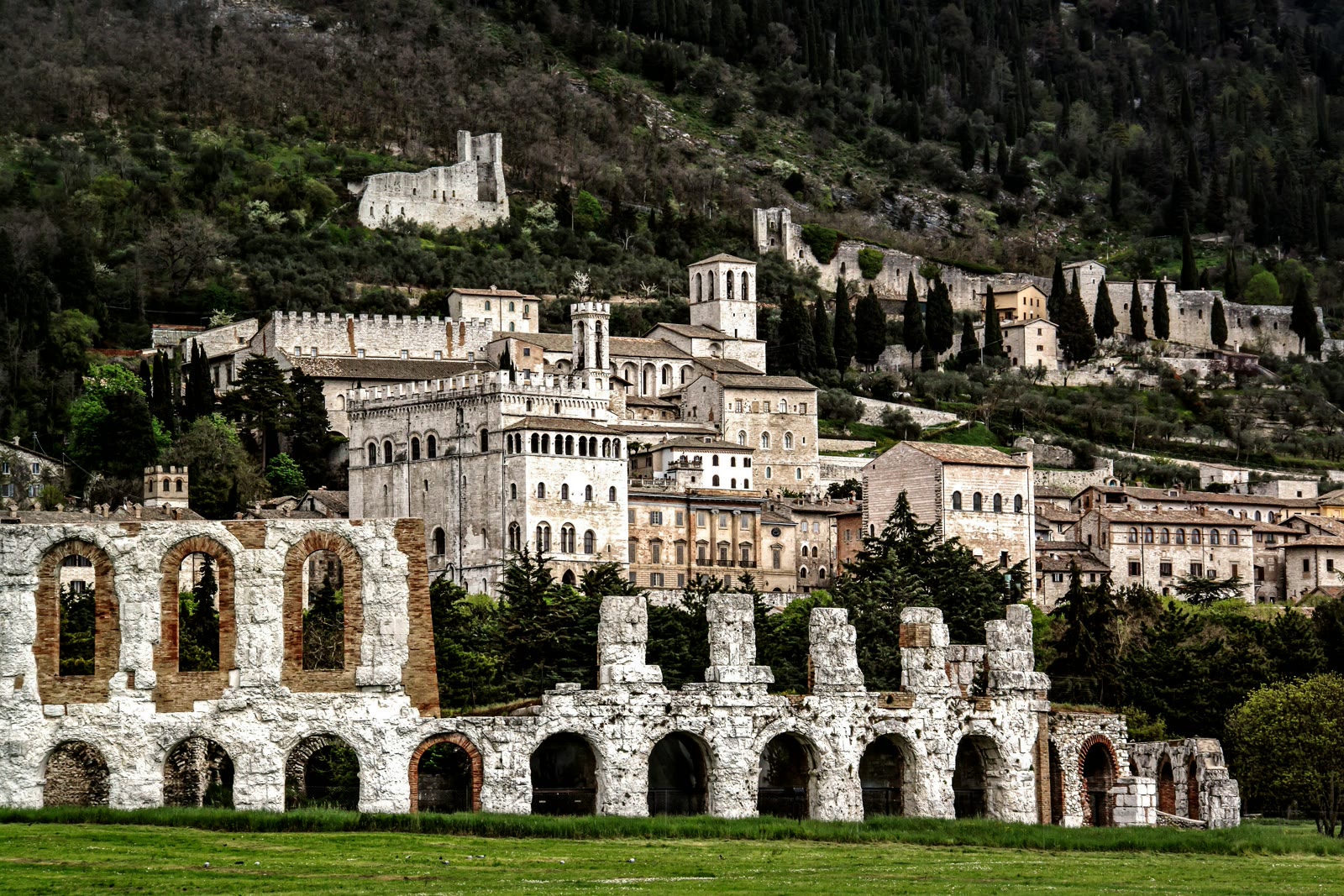 Brown building near a green grass field in Gubbio, Umbria, Italy
