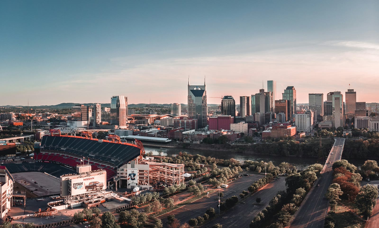 Football stadium next to a building and road in Nashville, Tennessee, United States