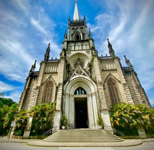 White and brown church under blue sky in Petropolis, Rio de Janeiro, Brazil