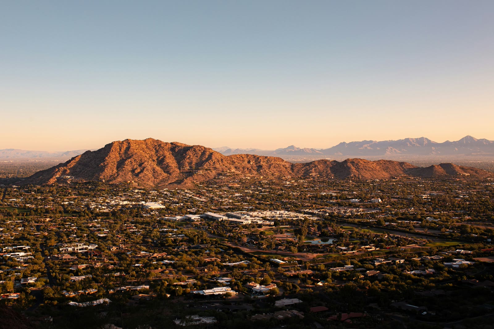Aerial view of a city with mountains in the background in Phoenix, Arizona, United States