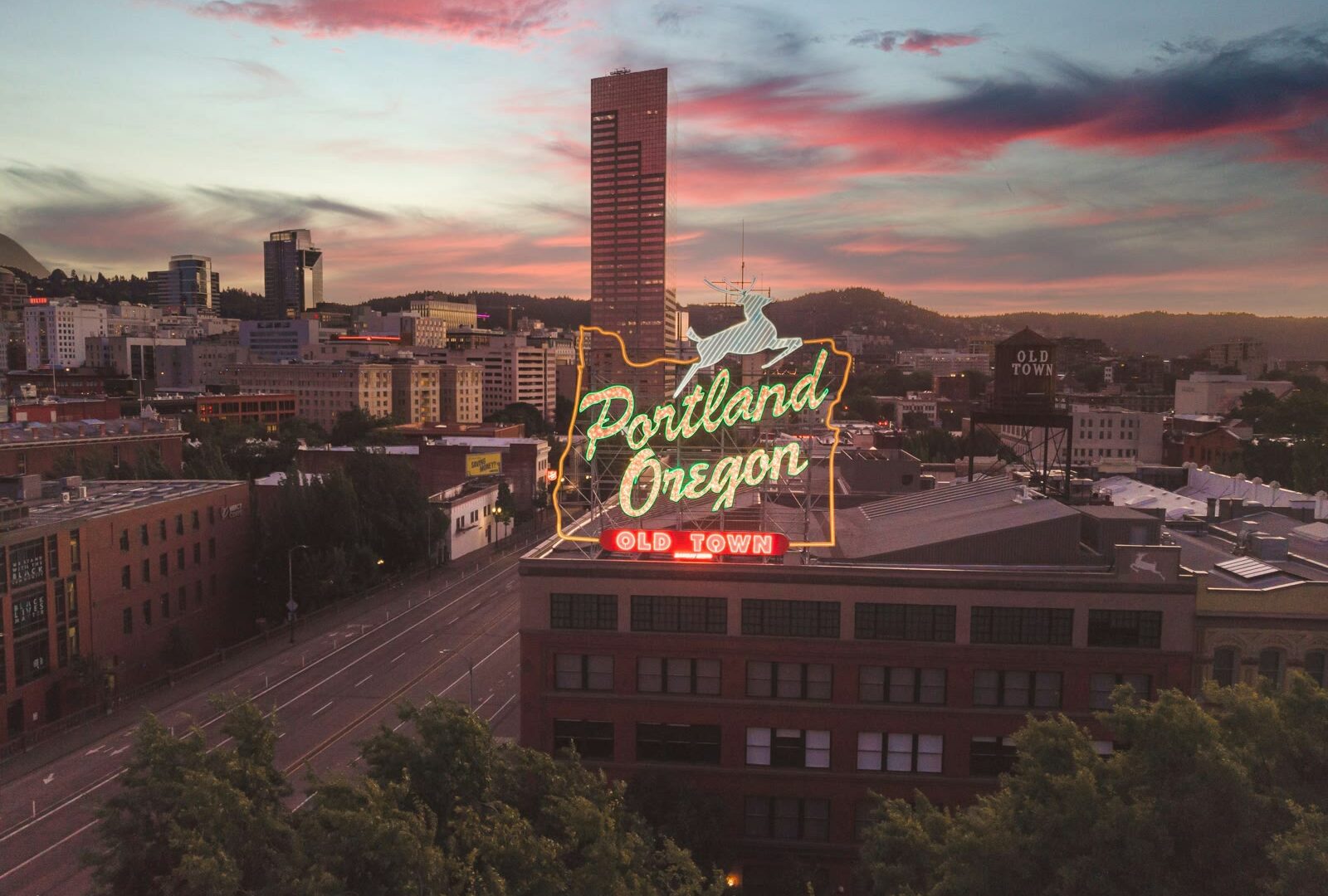 Large neon sign on top of a building in Portland, Oregon, United States