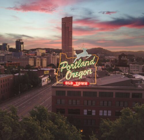 Large neon sign on top of a building in Portland, Oregon, United States