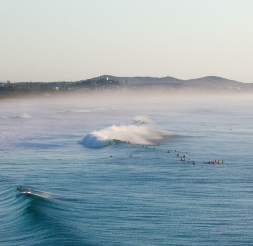 People surfing on the waves in Sunshine Coast, Queensland, Australia