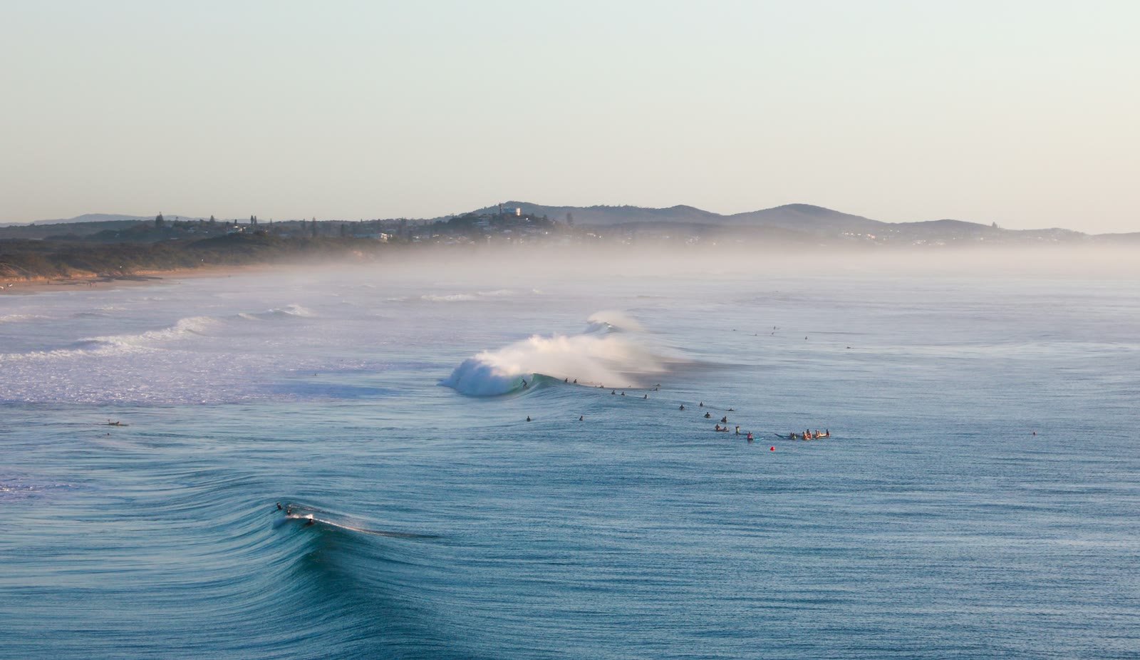 People surfing on the waves in Sunshine Coast, Queensland, Australia