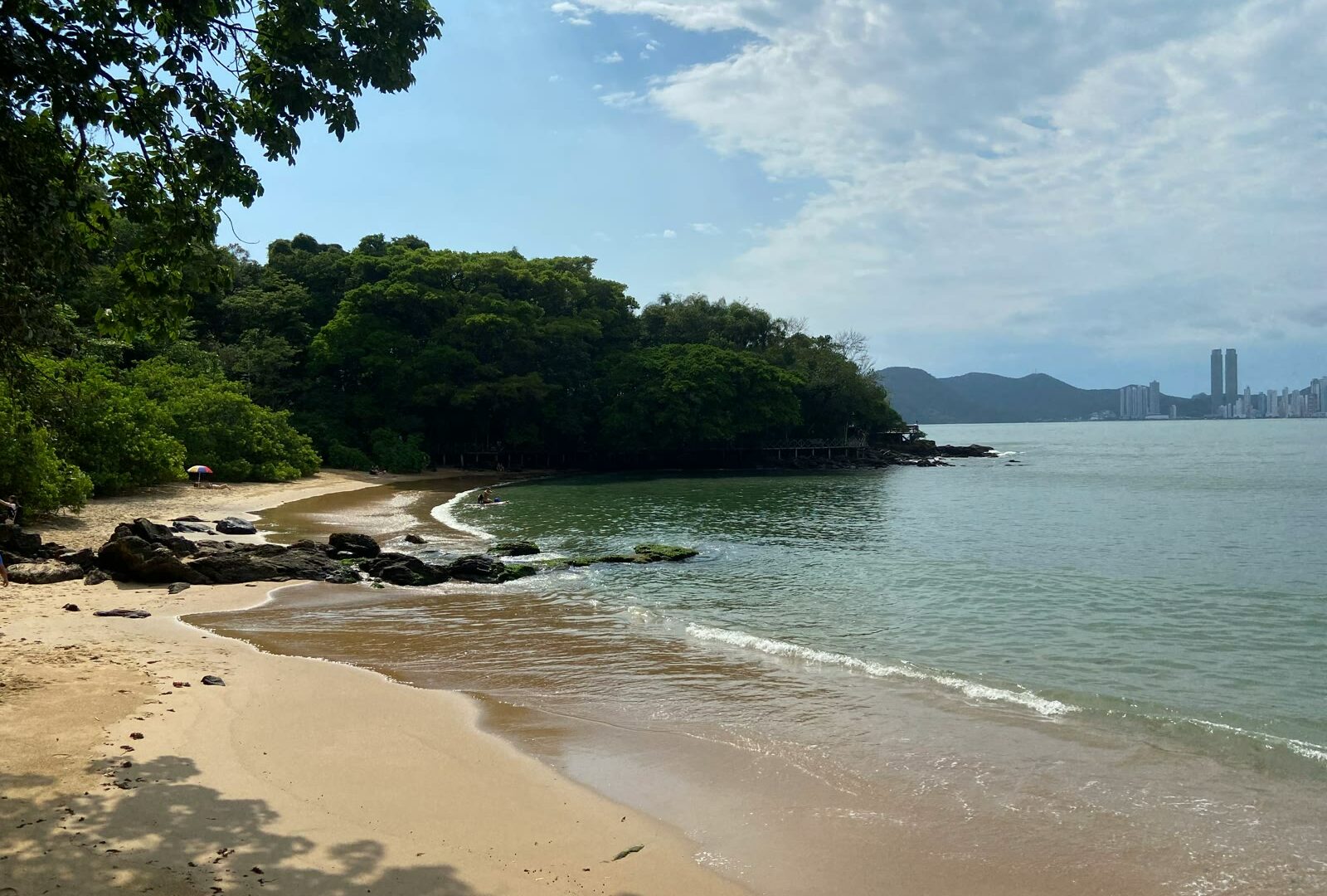 Sandy beach with the city skyline in the background in Balneário Camboriú, Santa Catarina, Brazil