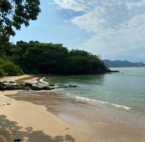Sandy beach with the city skyline in the background in Balneário Camboriú, Santa Catarina, Brazil