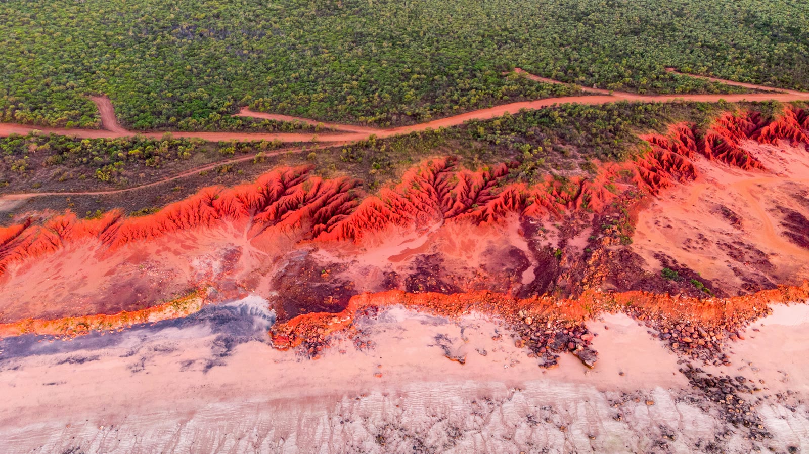 Aerial view of green grass field in Broome, Western Australia, Australia