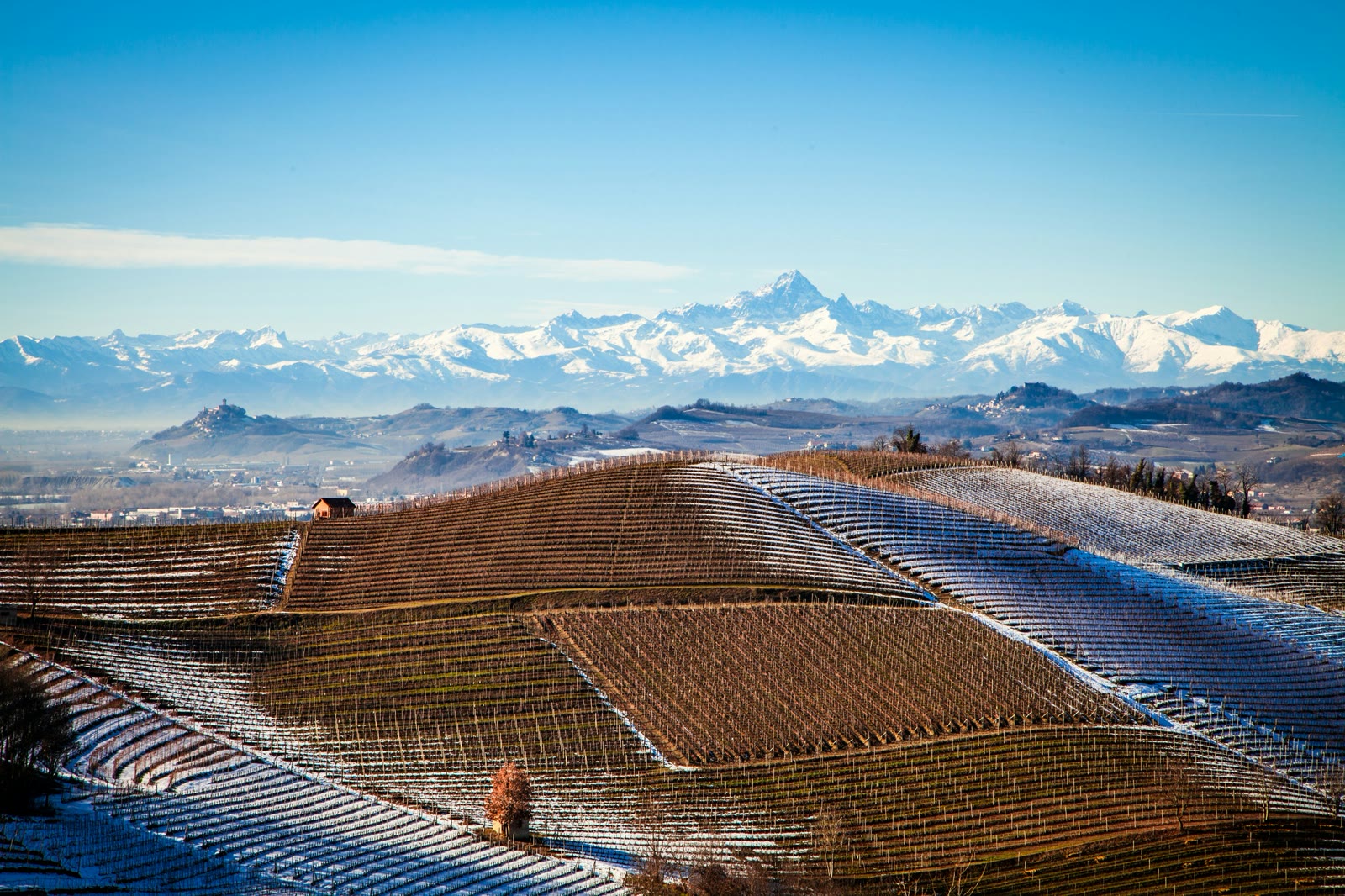 Snow-capped mountain range seen from a rooftop in Cuneo, Piedmont, Italy