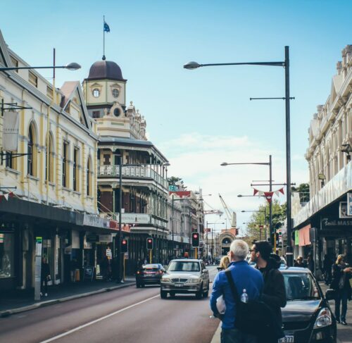 People walking on a street near tall buildings in Fremantle, Western Australia, Australia