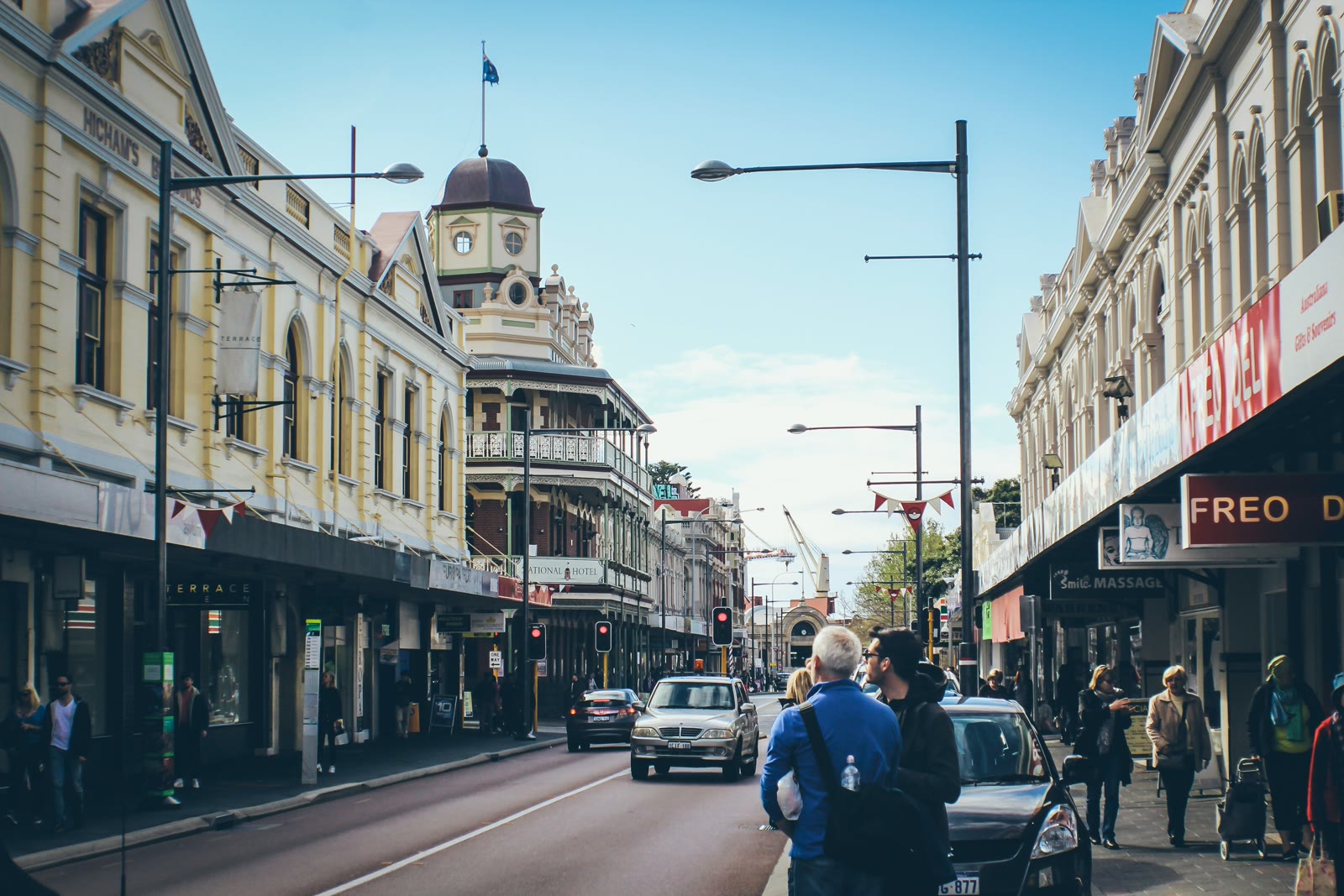 People walking on a street near tall buildings in Fremantle, Western Australia, Australia