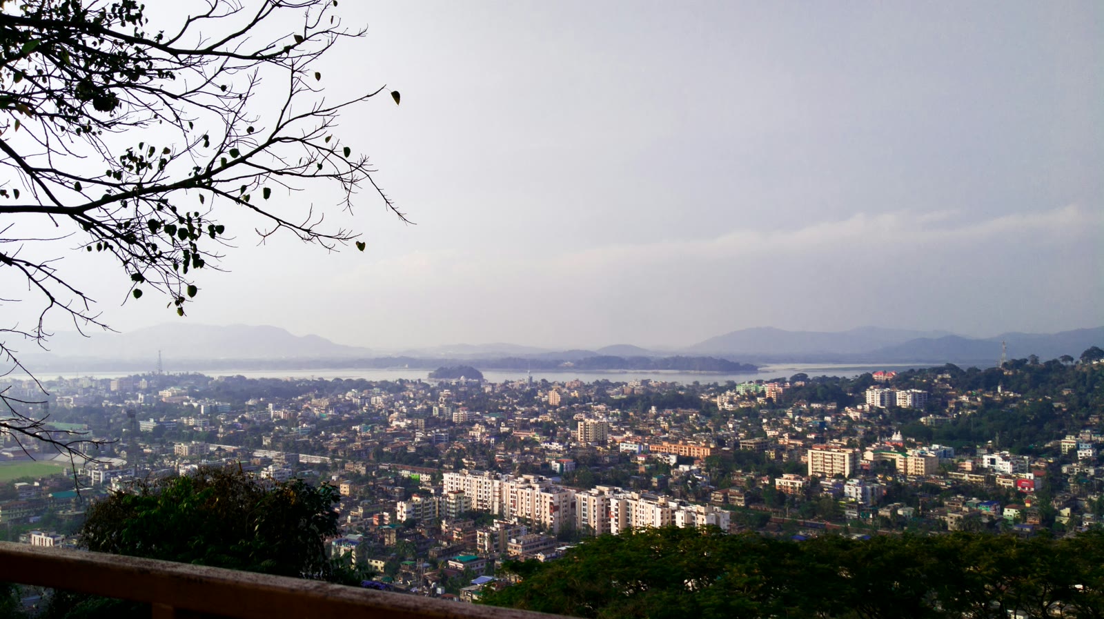 City with tall buildings under white sky in Guwahati, Assam, India