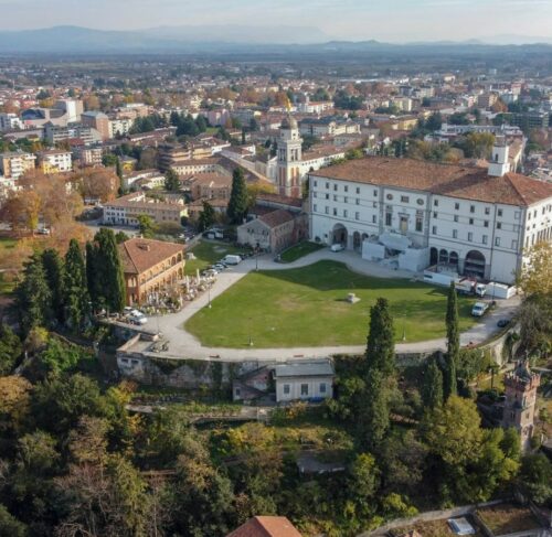 Aerial daytime view of Udine with rooftops and streets, Friuli-Venezia Giulia, Italy